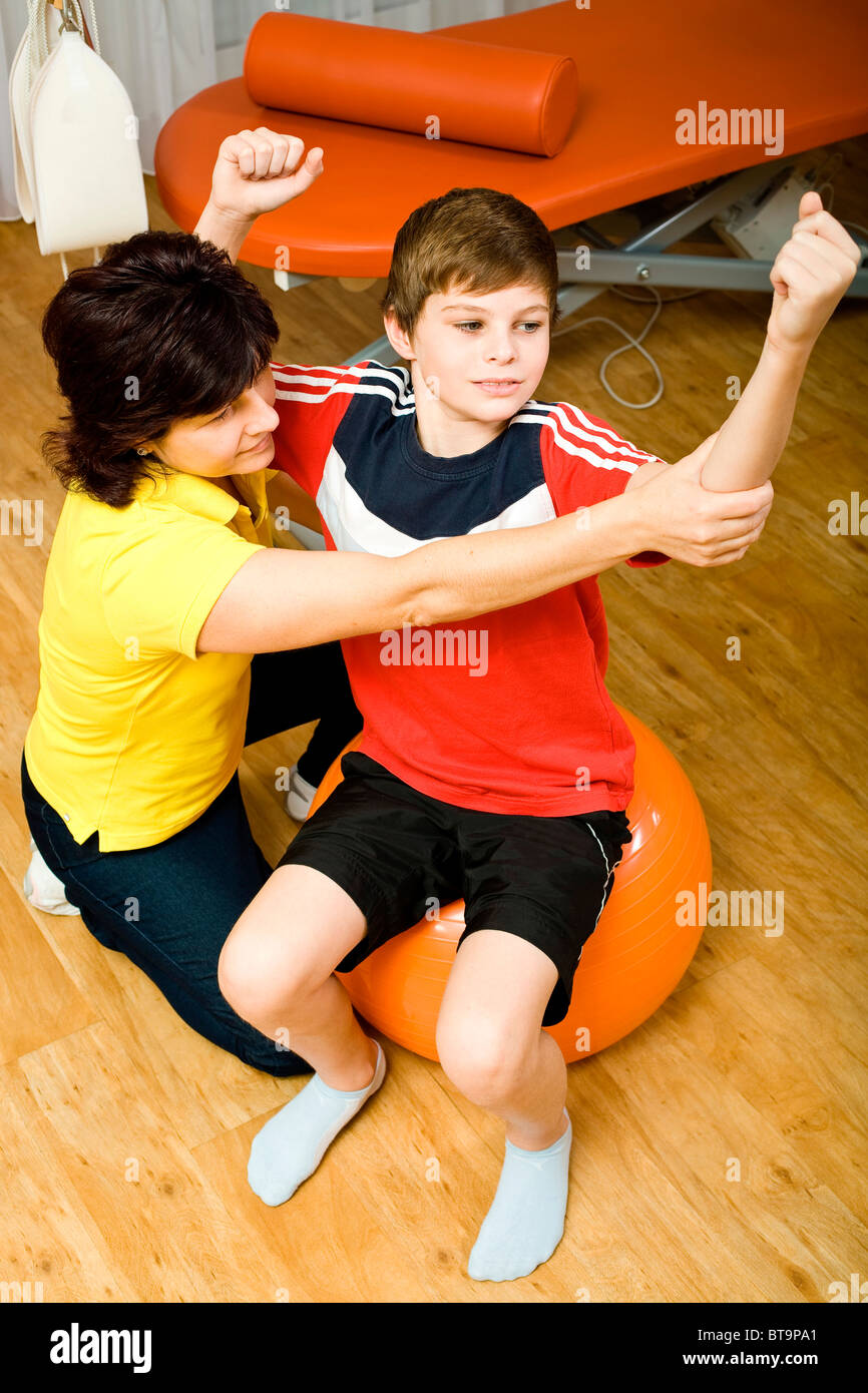 Physical therapist doing physical therapy with a patient Stock Photo