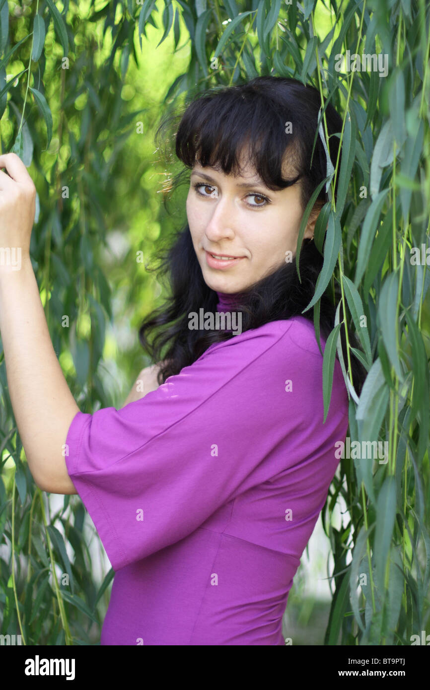 The green willow and the young woman Stock Photo Alamy
