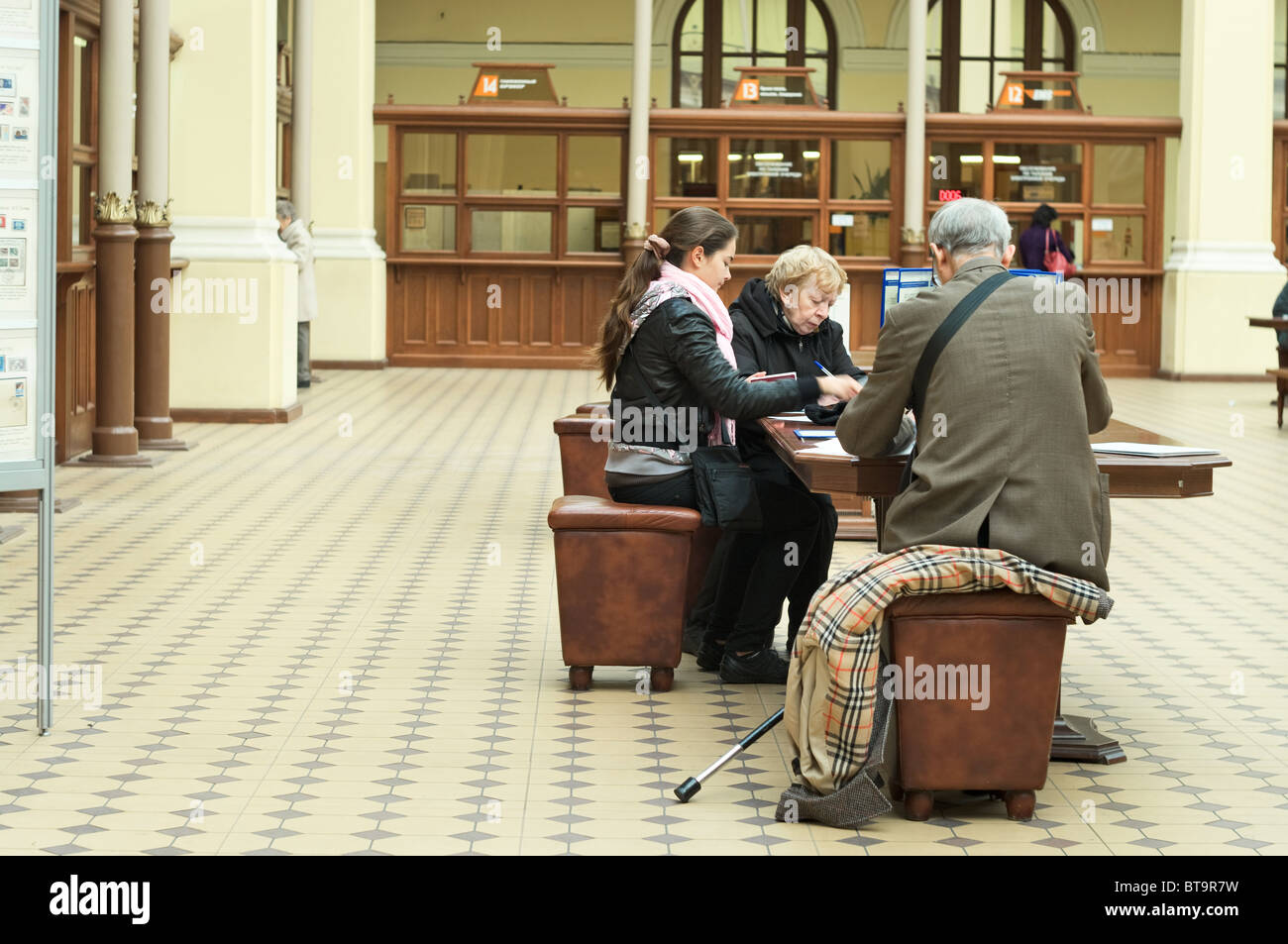Interior of Main Post Office of Russian Post in SaintPetersburg, Russia. People inside of