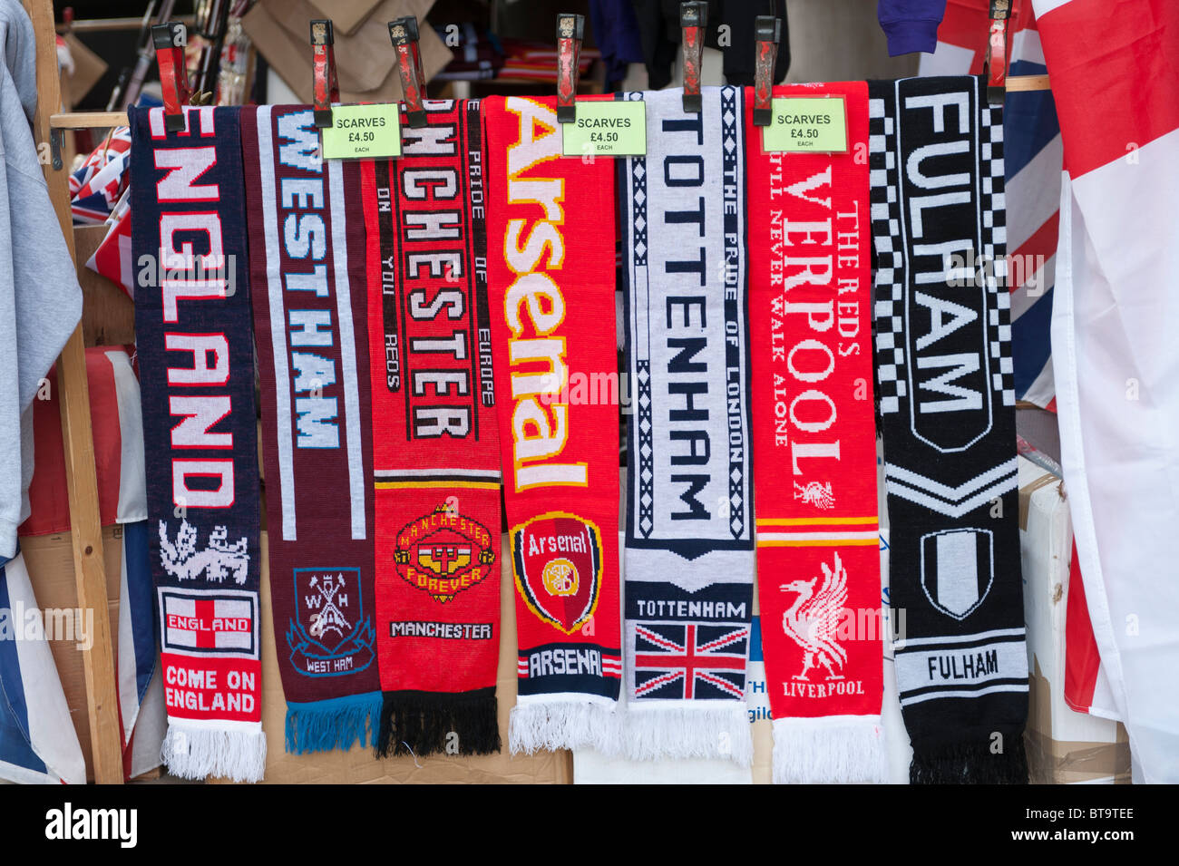 Assorted football scarves on sale at a kiosk on Whitehall, London Stock Photo