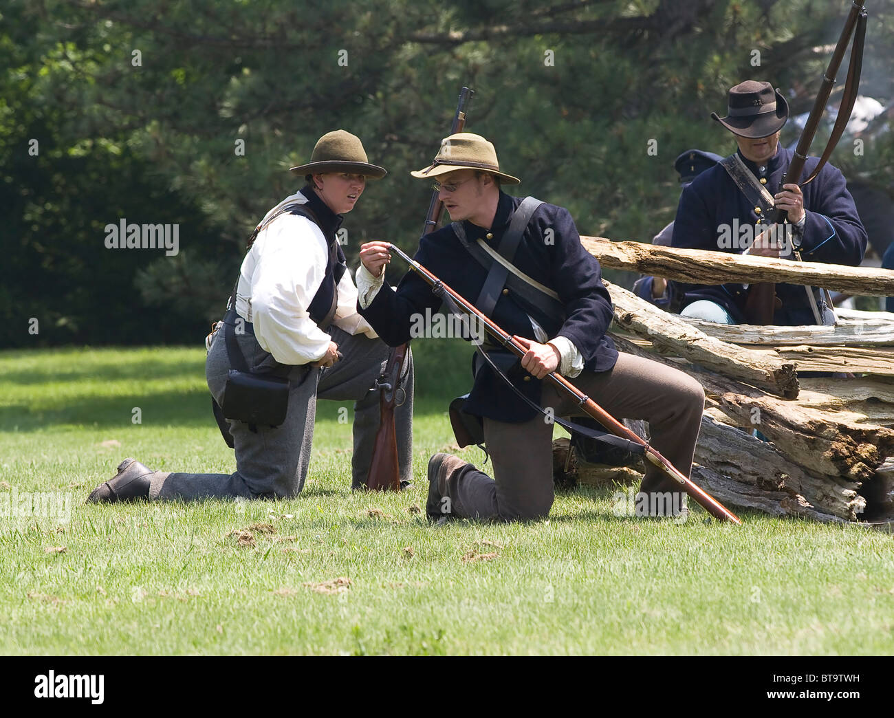 Members of the attacking Fenian Army occupy a position during a reenactment of the Fenian Raids at Old Fort Erie in Ontario. Stock Photo