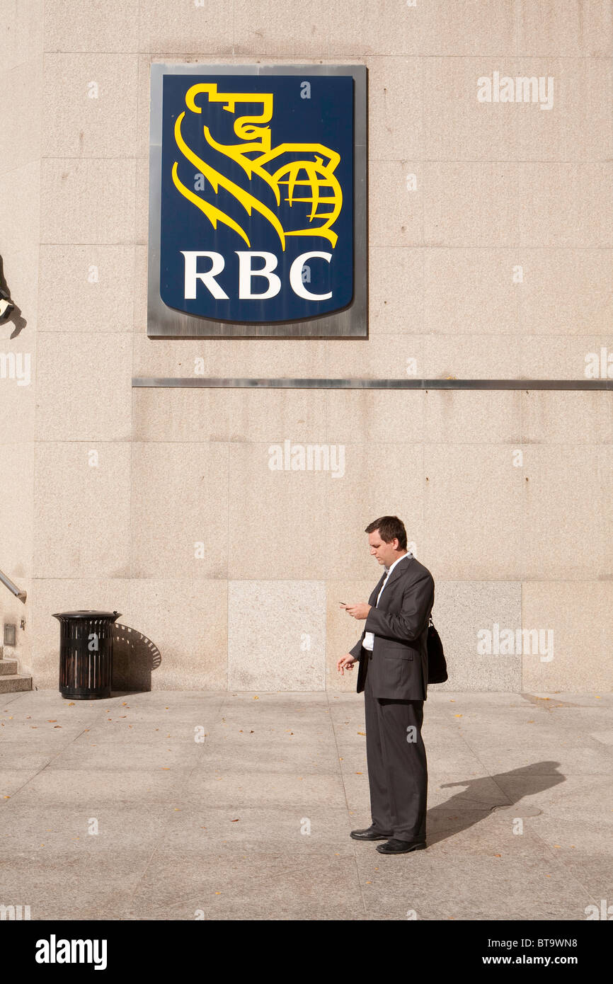 Businessman taking a break in the plaza near the Royal Bank of Canada on Front Street, Toronto. Stock Photo