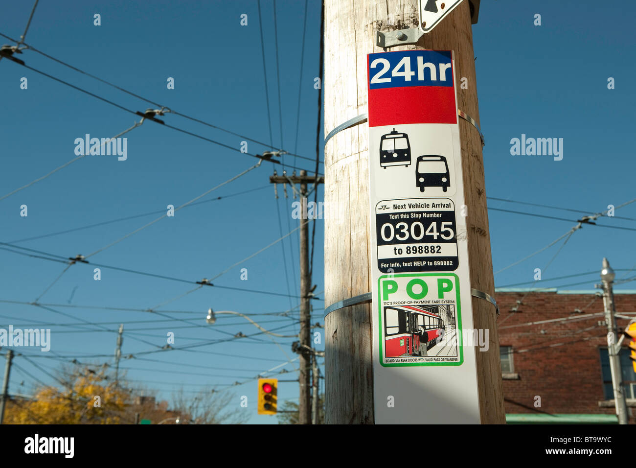 At bus- and streetcar-stops in Toronto, riders can text the stop number to get the arrival time of the next bus or trolley. Stock Photo