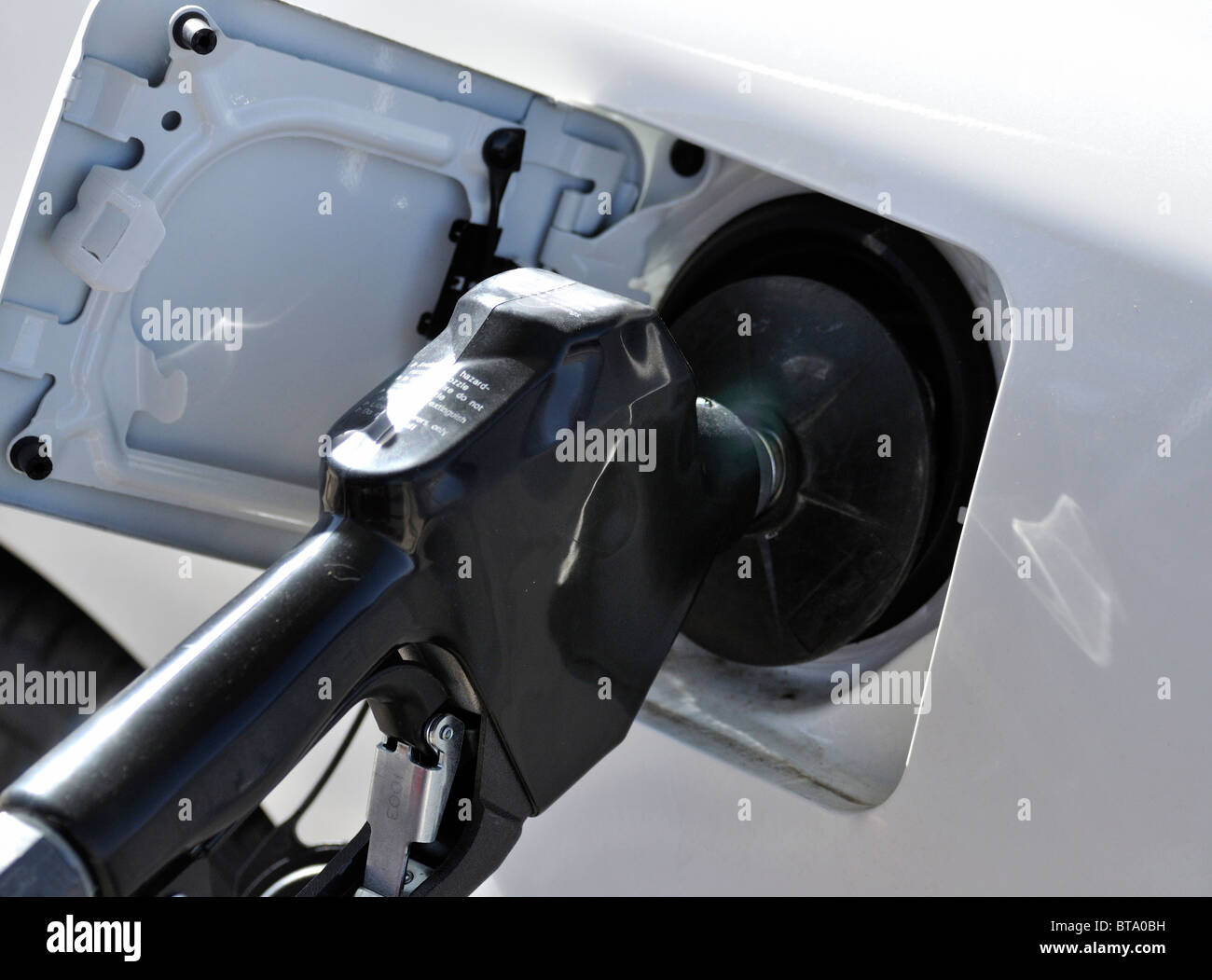 Gas Petrol pump nozzle in auto fuel tank Stock Photo Alamy