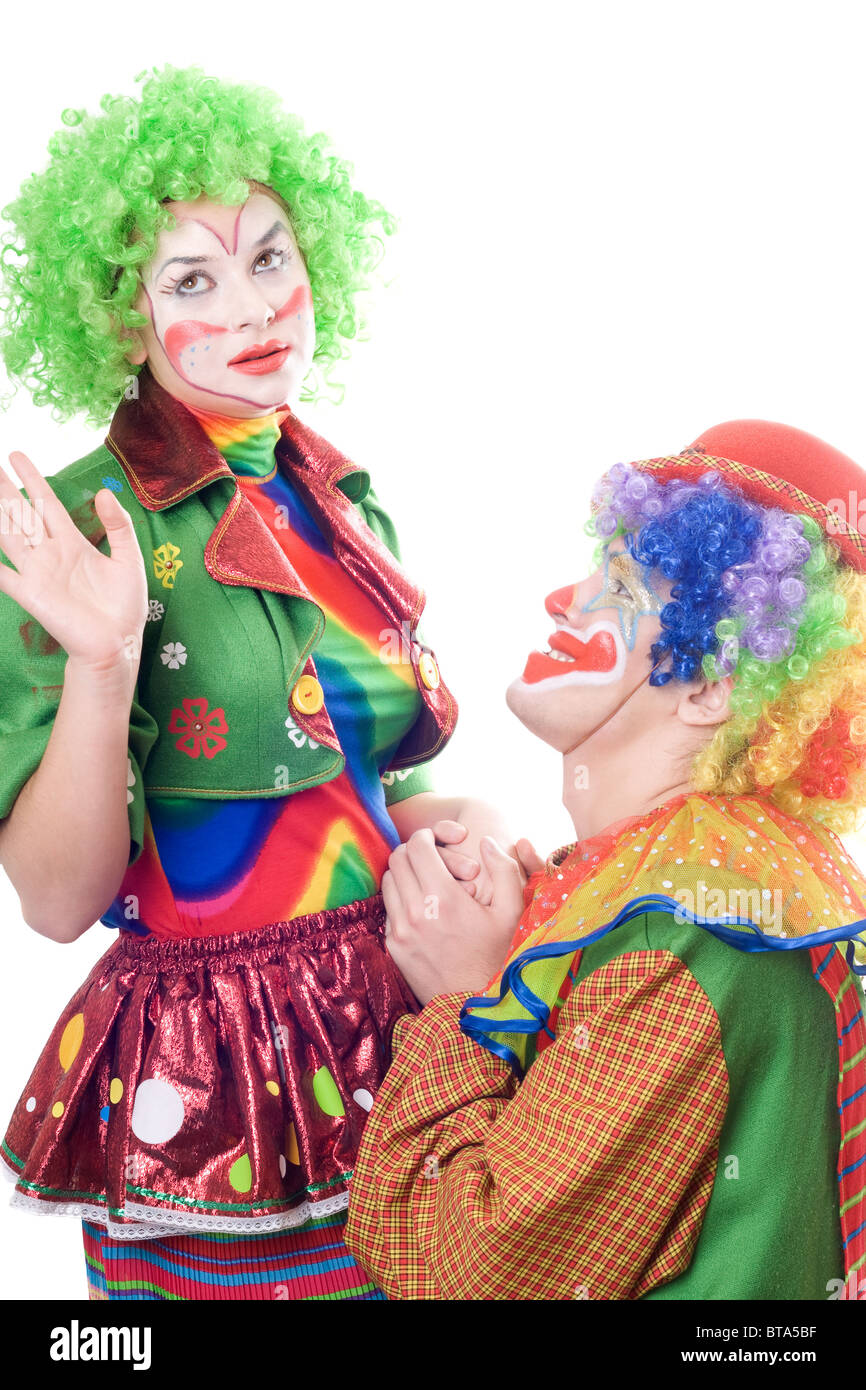 Female clown punching clown. Isolated on white Stock Photo Alamy