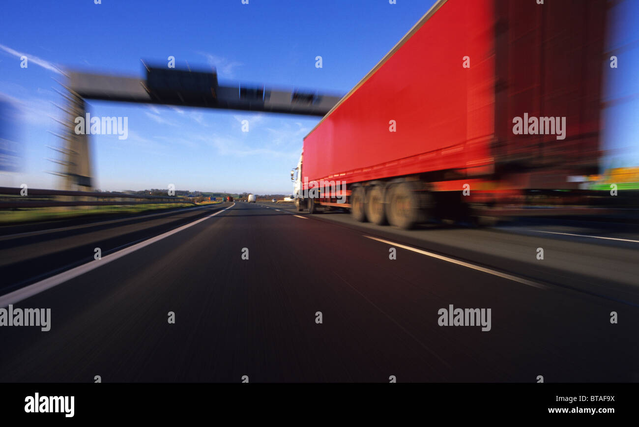 articulated lorry overtaking vehicle on the a1 m1 motorway near leeds yorkshire uk Stock Photo