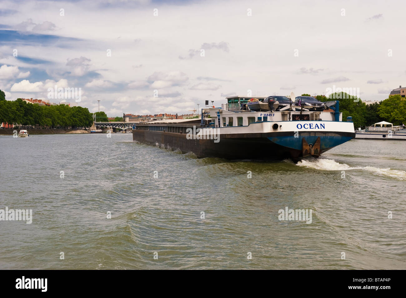 Barge navigating on the Saone river, Lyon, France Stock Photo