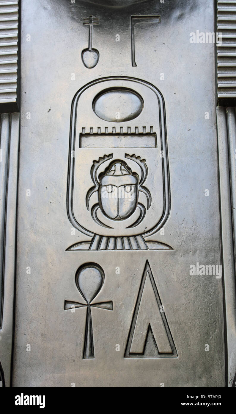 Hieroglyphic inscription on a bronze sphinx at the base of Cleopatra's Needle, Victoria Embankment, London, England, UK Stock Photo