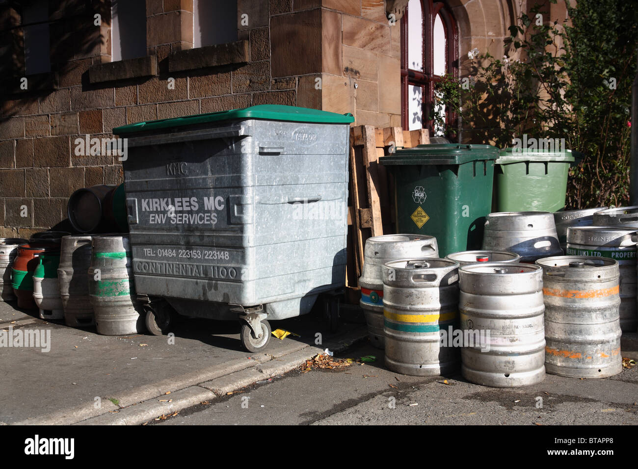 kegs and bin outside dewsbury pub Stock Photo