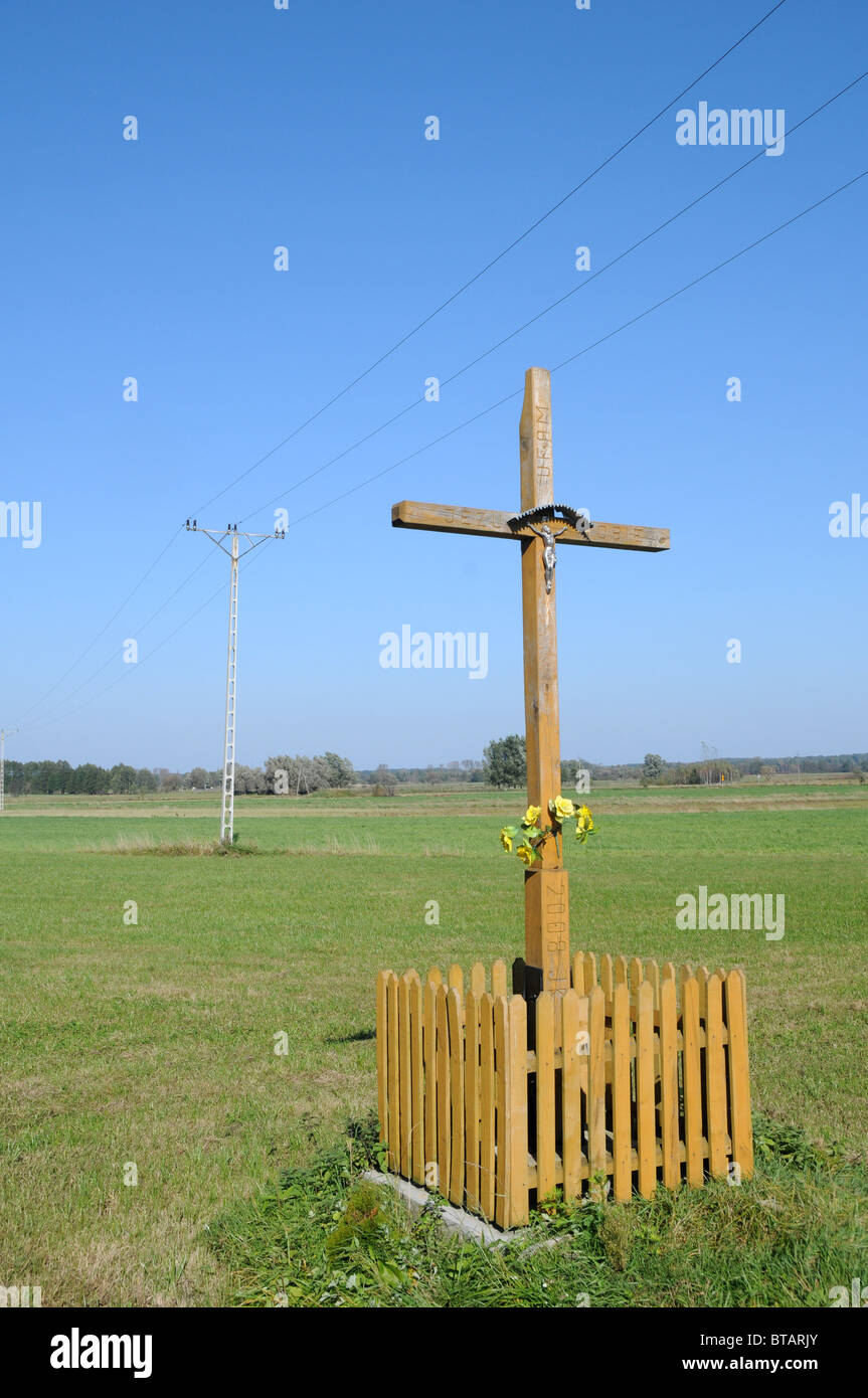 Wooden wayside cross on polish country Stock Photo