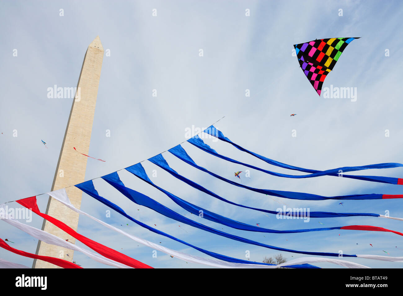 Kites flying on the National Mall near the Washington Monument during the annual Smithsonian