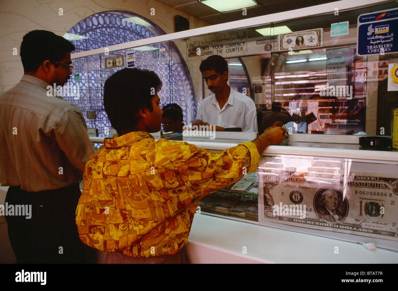 Sharjah UAE Money Exchange People At Counter Stock Photo