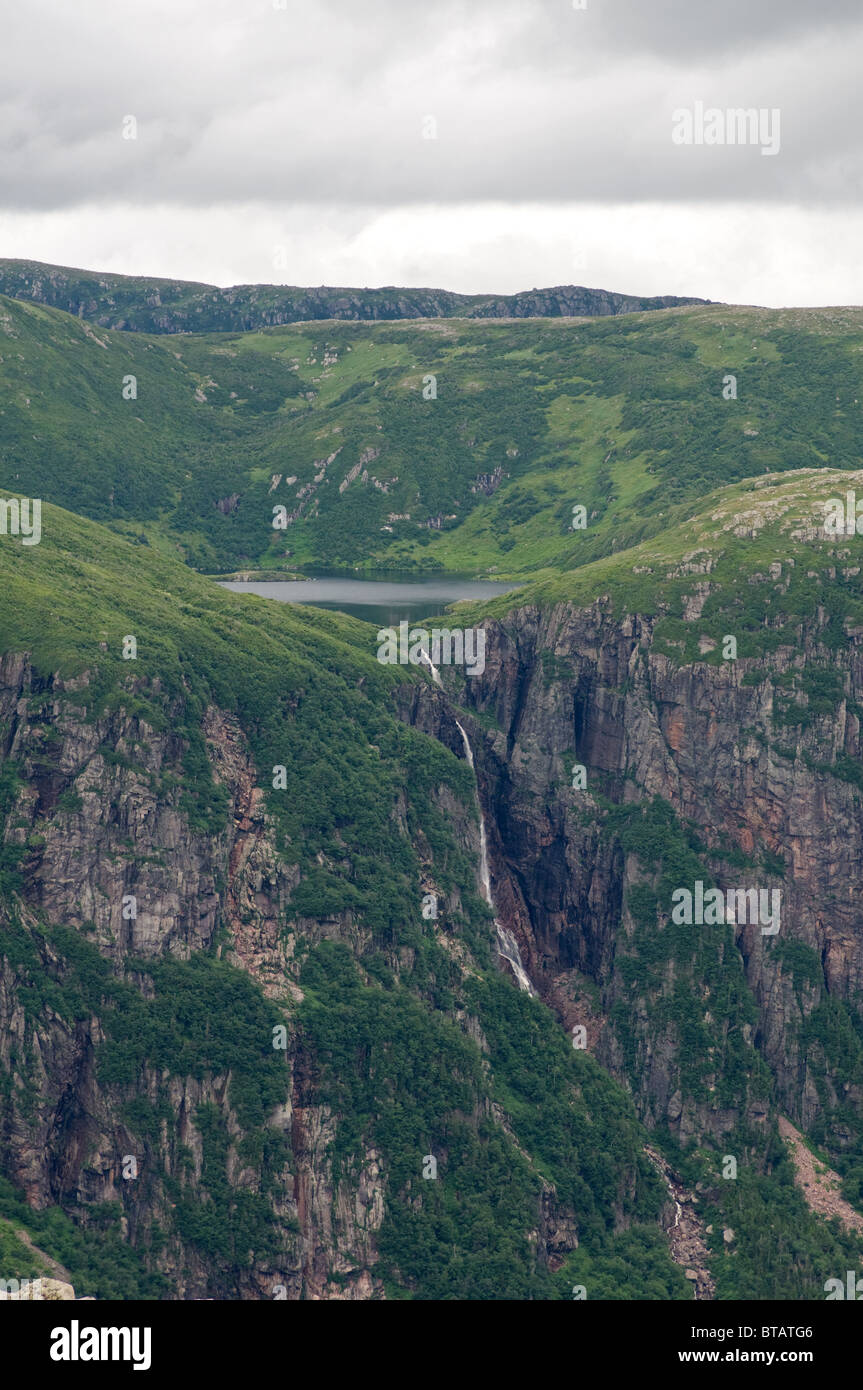 View of Water Falls from Gros Morne Mountain falling into Ten Mile Pond Stock Photo