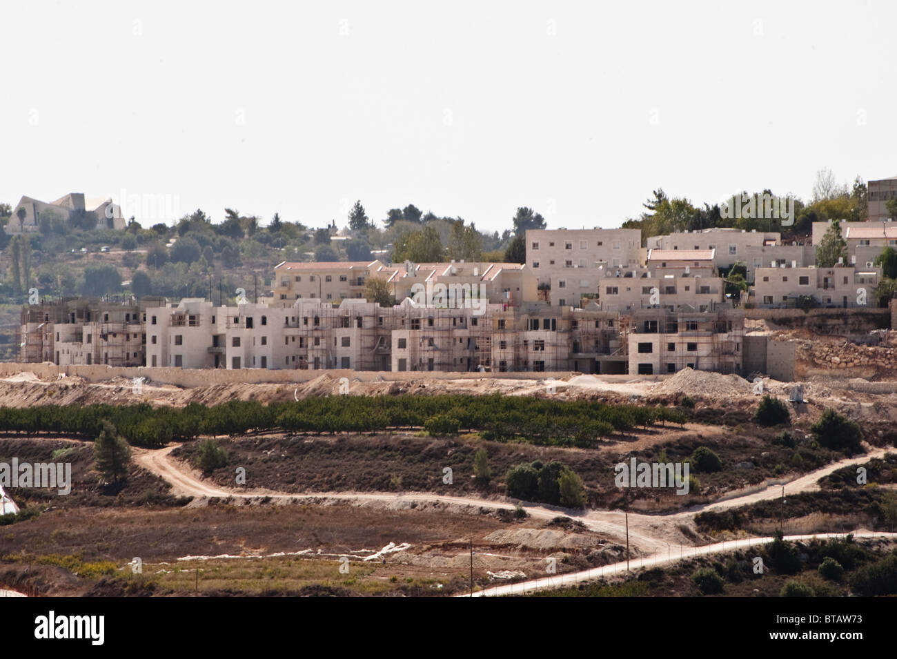 Construction of Jewish homes continues in the Rosh Tzurim section of the Gush Etzion Israeli settlement bloc. Stock Photo