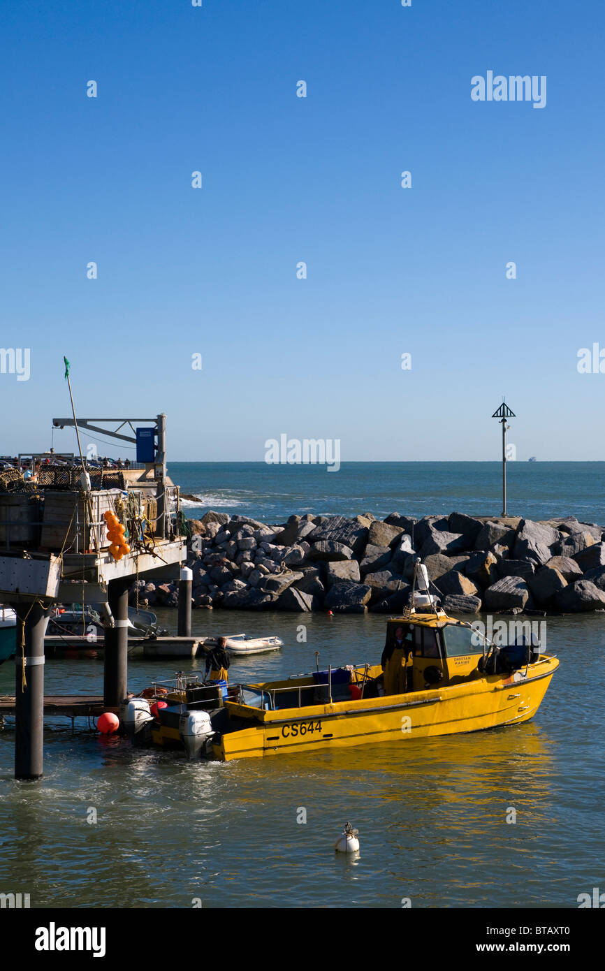 Crab fishing boat leaving port at Ventnor, Isle of Wight Stock Photo