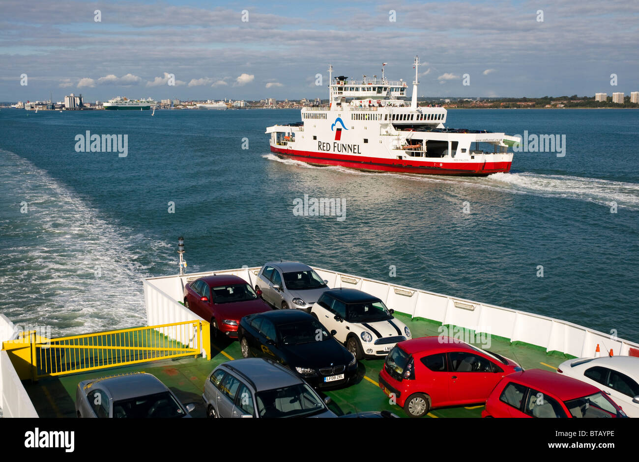 The Red Falcon, one of the ferries operated by Red Funnel, Passing Red Eagle, on Southampton Water Stock Photo