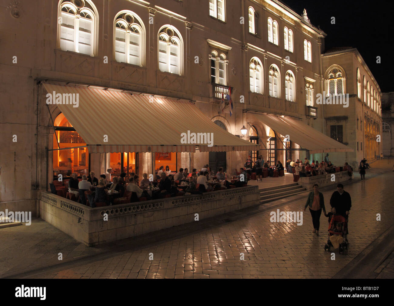 Croatia, Dubrovnik, street scene at night, restaurant, people, Stock Photo