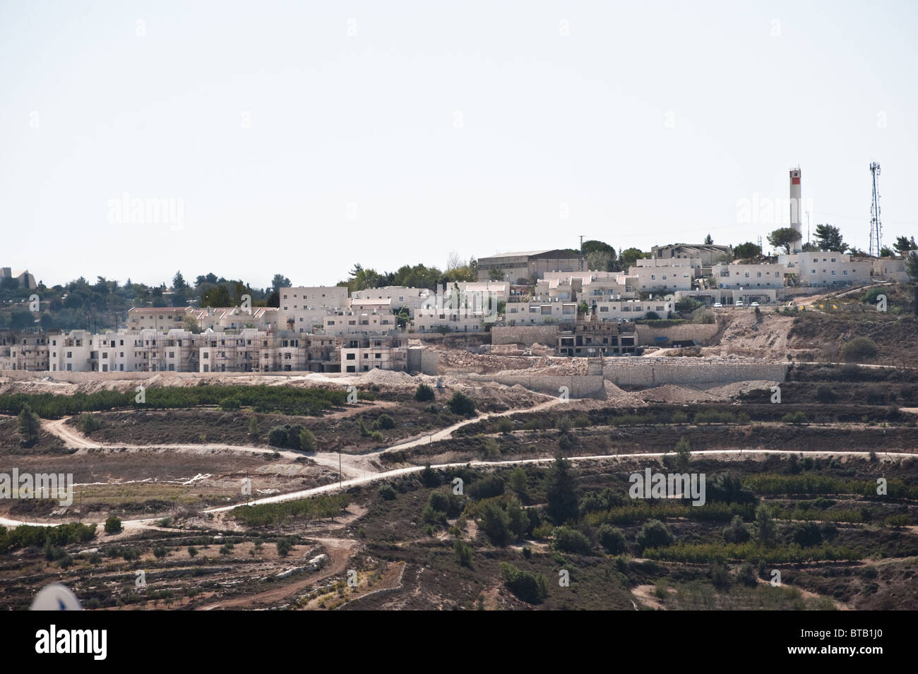 Construction of Jewish homes continues in the Rosh Tzurim section of the Gush Etzion Israeli settlement bloc. Stock Photo