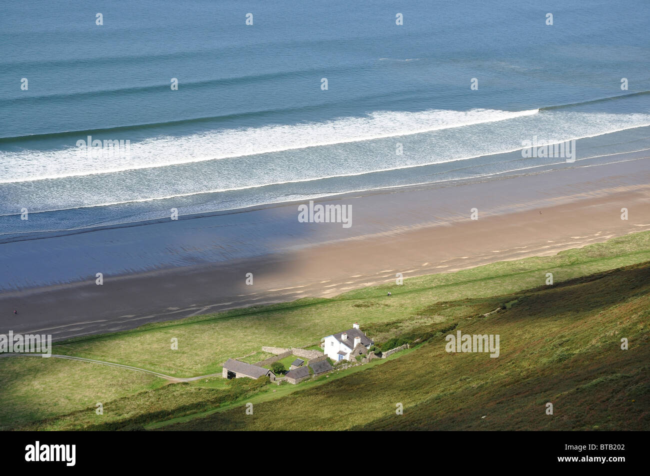 Isolated house on beach in Rhossili Swansea Wales Stock Photo