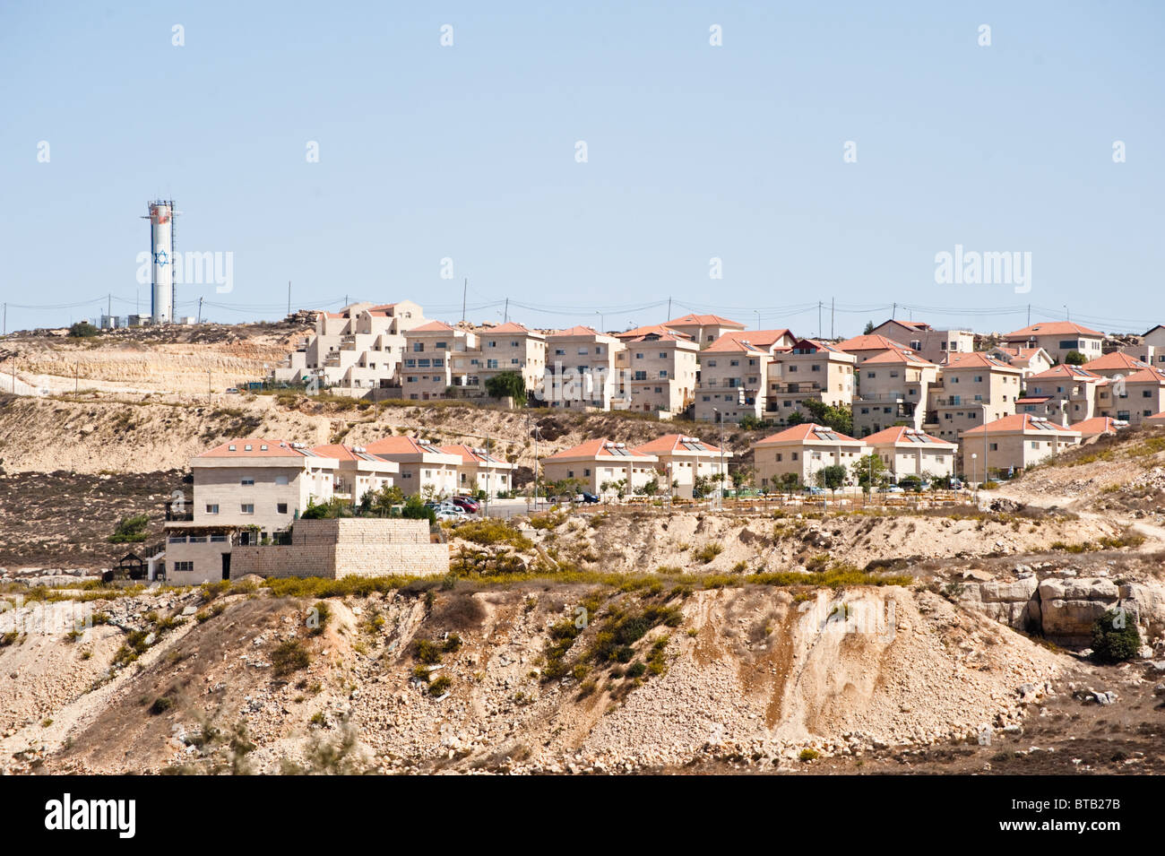 A tower bearing the Star of David rises above Jewish homes in the Neve Daniel section of the Gush Etzion Israeli settlement bloc Stock Photo