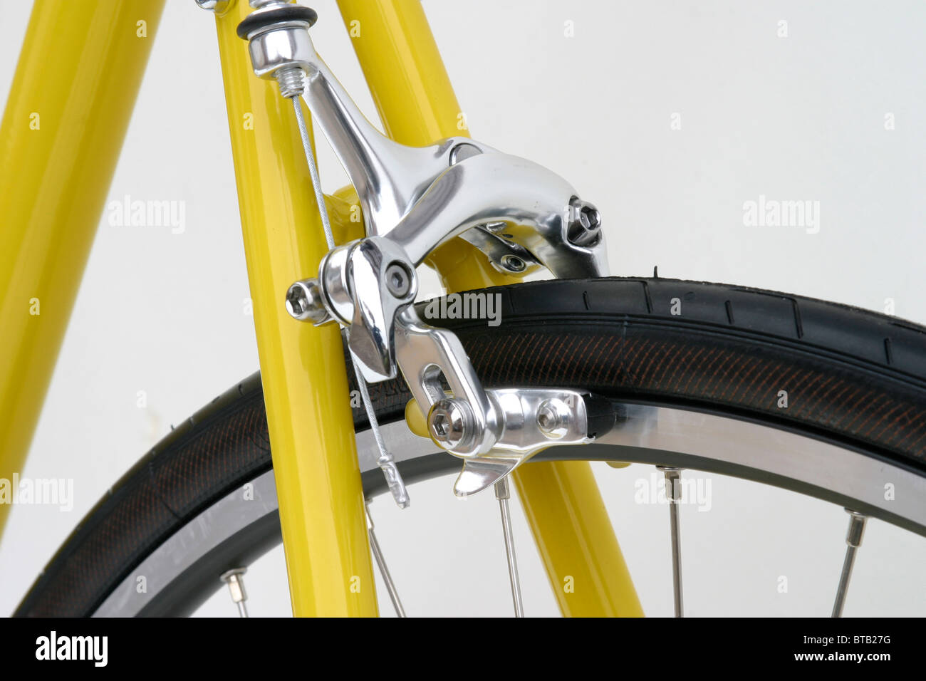 cutout closeup of rear brake yellow hybrid roadster trekking fitness