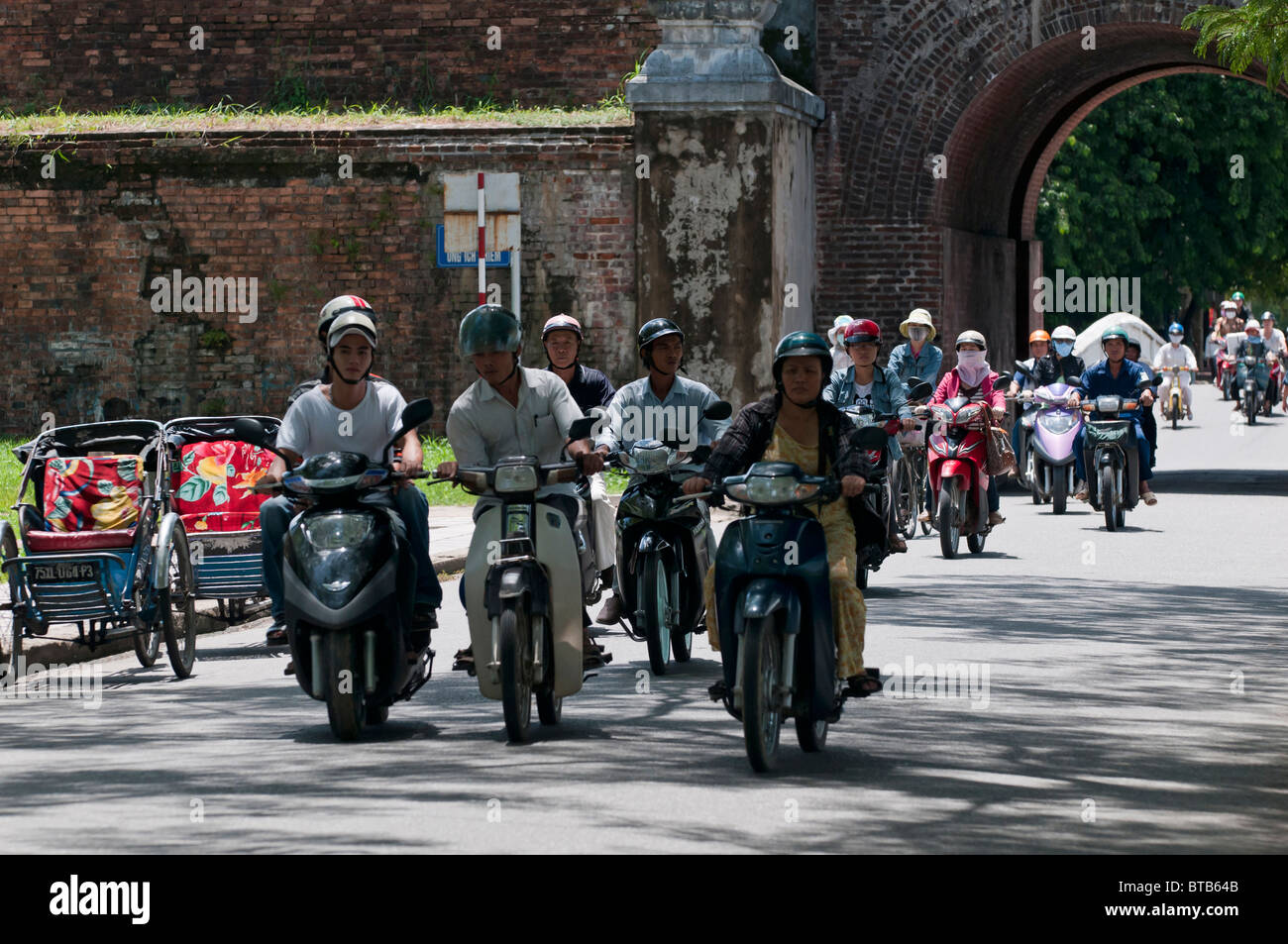 Busy Traffic at the Ngan Gate by the Entrance to the Imperial City of Hue, Vietnam Stock Photo