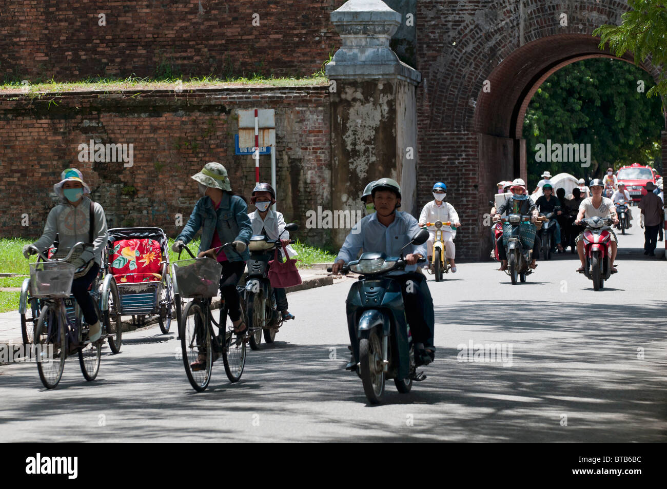 Busy Traffic at the Ngan Gate by the Entrance to the Imperial City of Hue, Vietnam Stock Photo