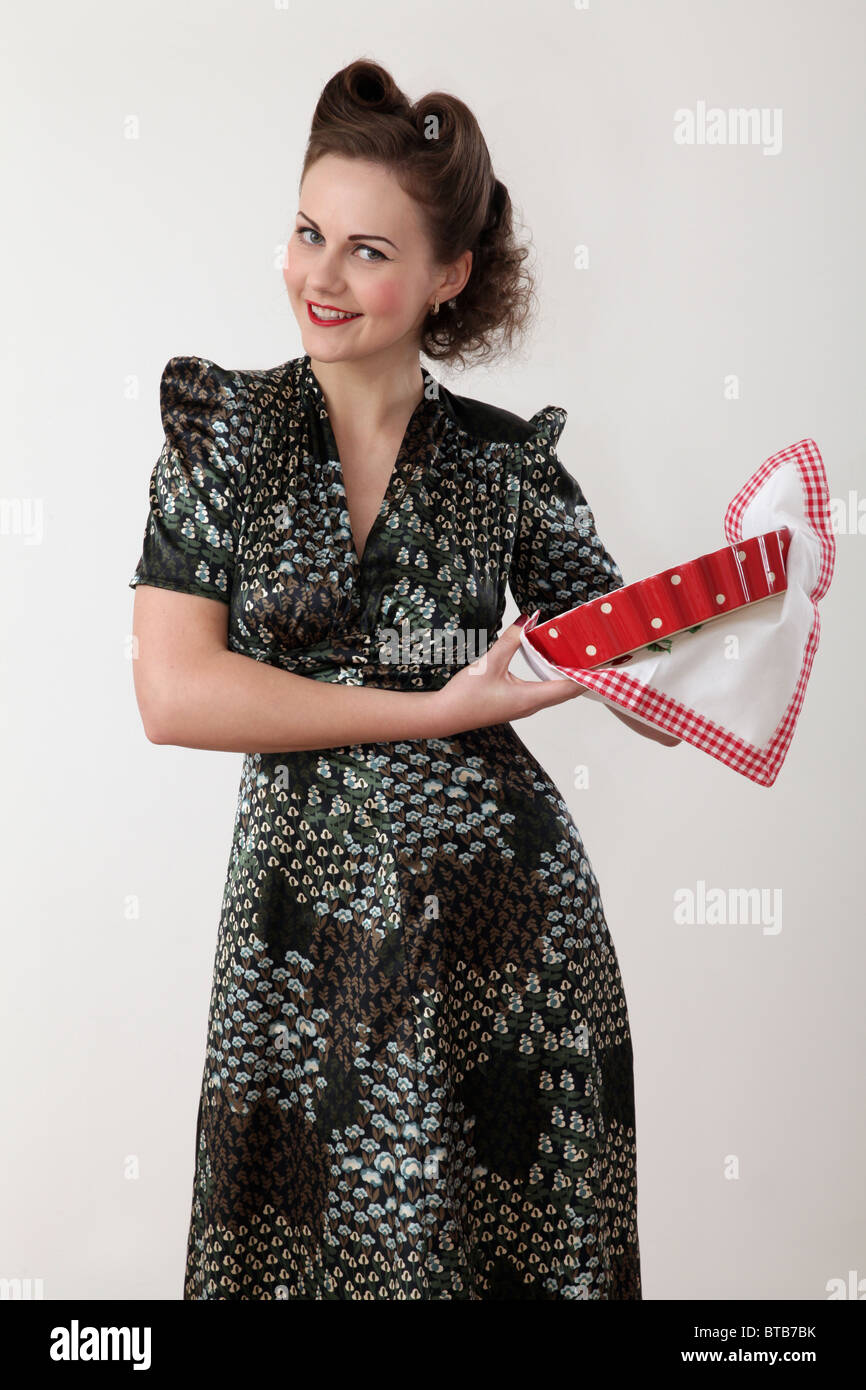 Woman holding a cooking dish Stock Photo