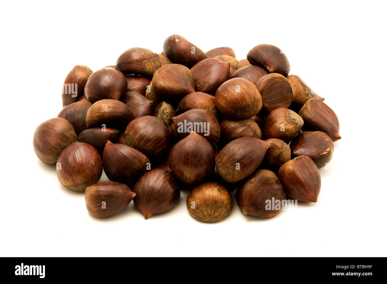Sweet chestnuts fruits on a white background Stock Photo