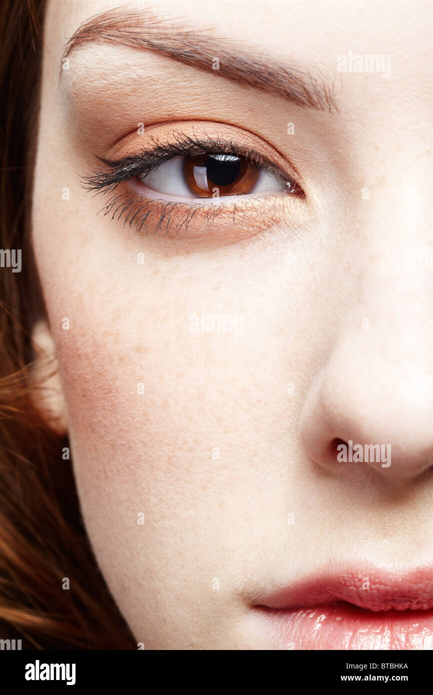 half-face portrait of pale freckled girl Stock Photo
