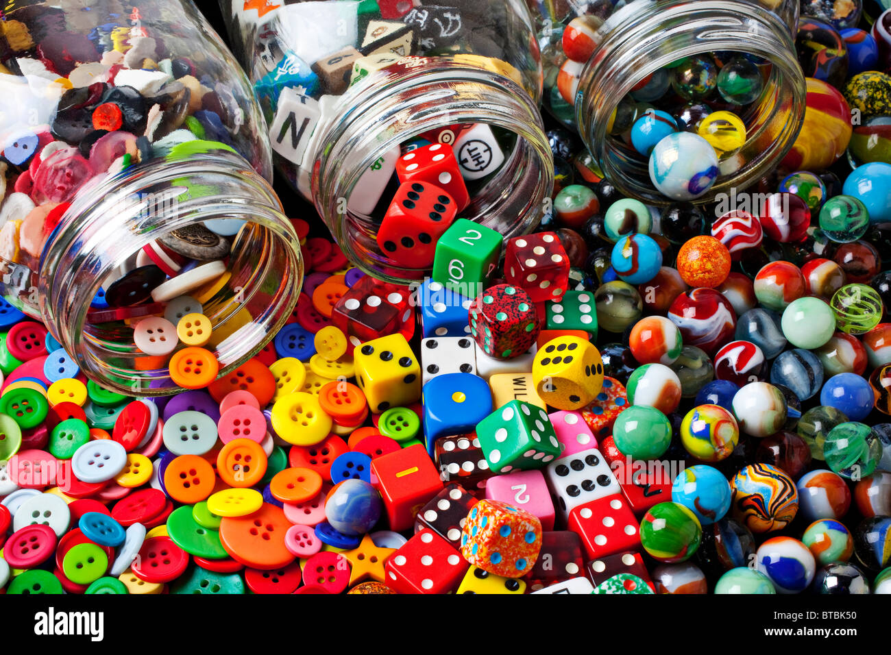 https://c8.alamy.com/comp/BTBK50/three-jars-of-buttons-dice-and-marbles-BTBK50.jpg