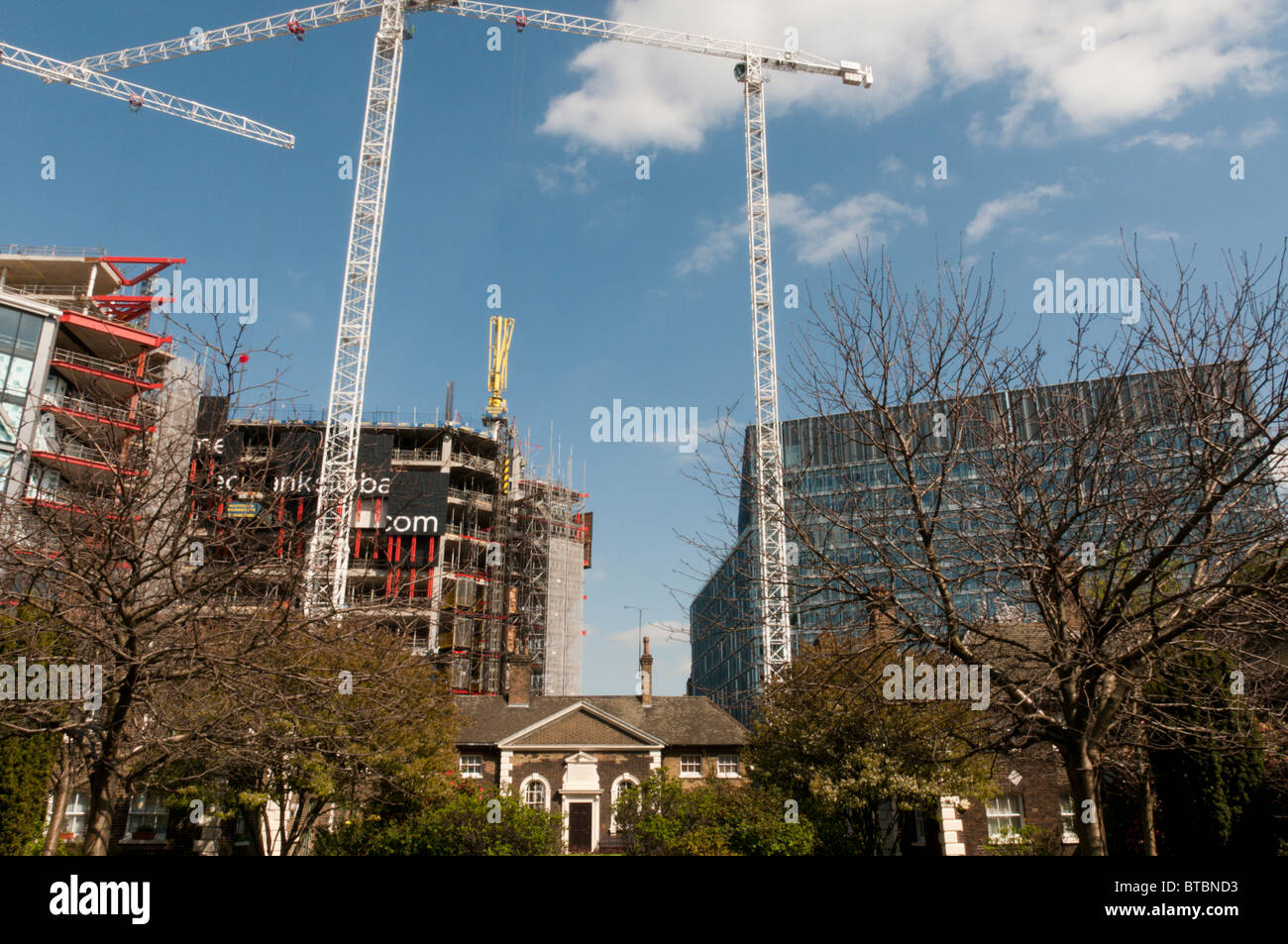 Hopton's Almshouses in Southwark, London with the NEO Bankside development in the background Stock Photo