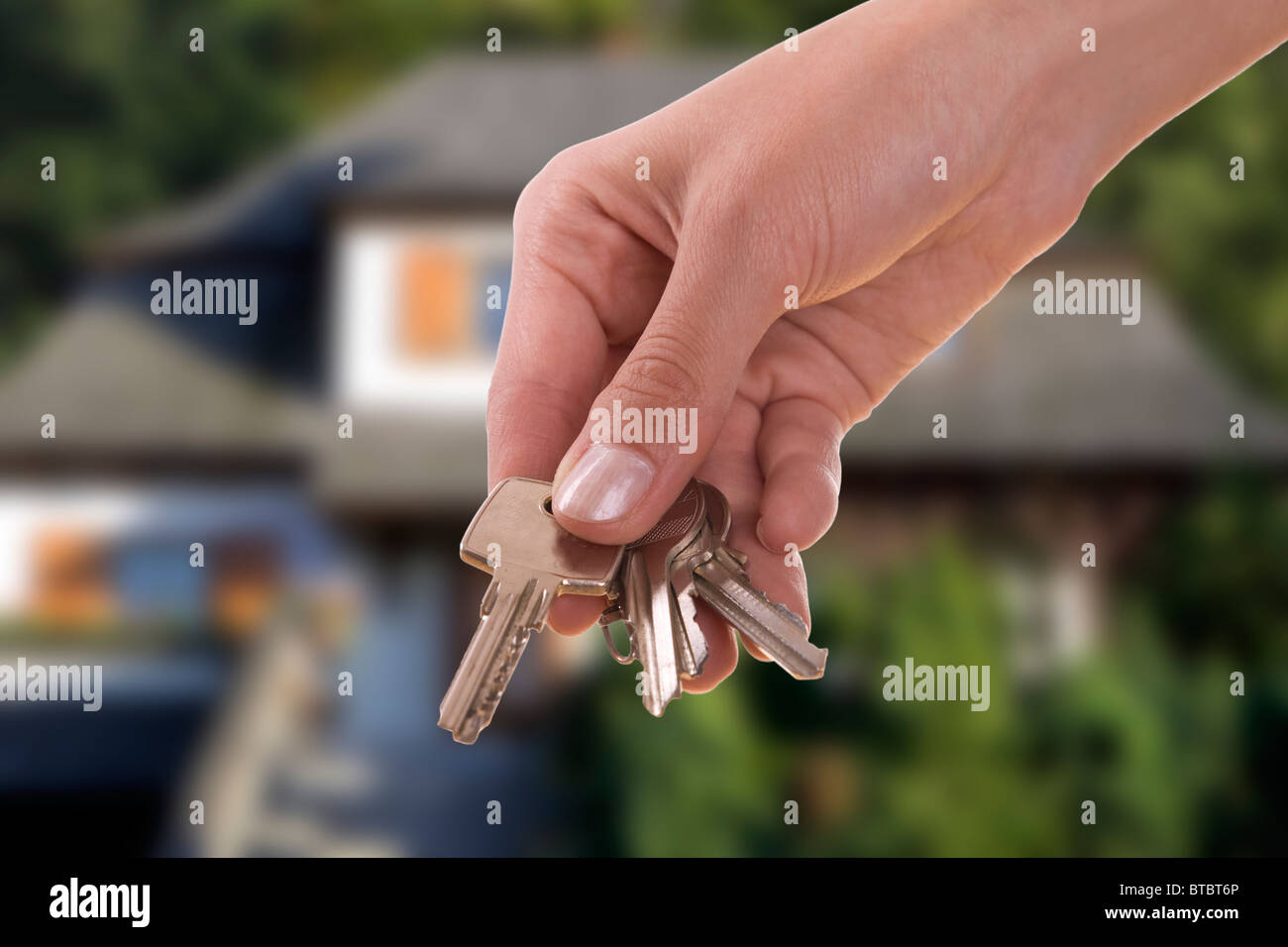 handing keys in the house background Stock Photo