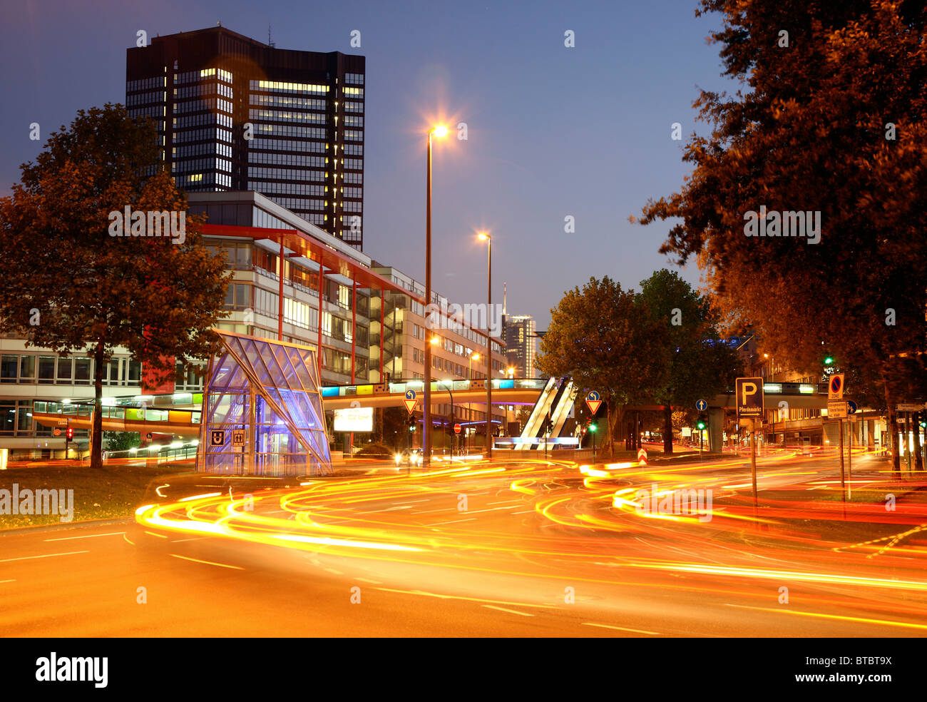 City center of Essen, Germany. Viehofer Platz, square at dusk, town hall, city traffic. Stock Photo