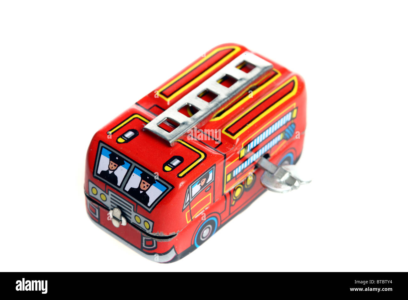 Tin toy, fire engine, wind up motor by a metal key. Stock Photo