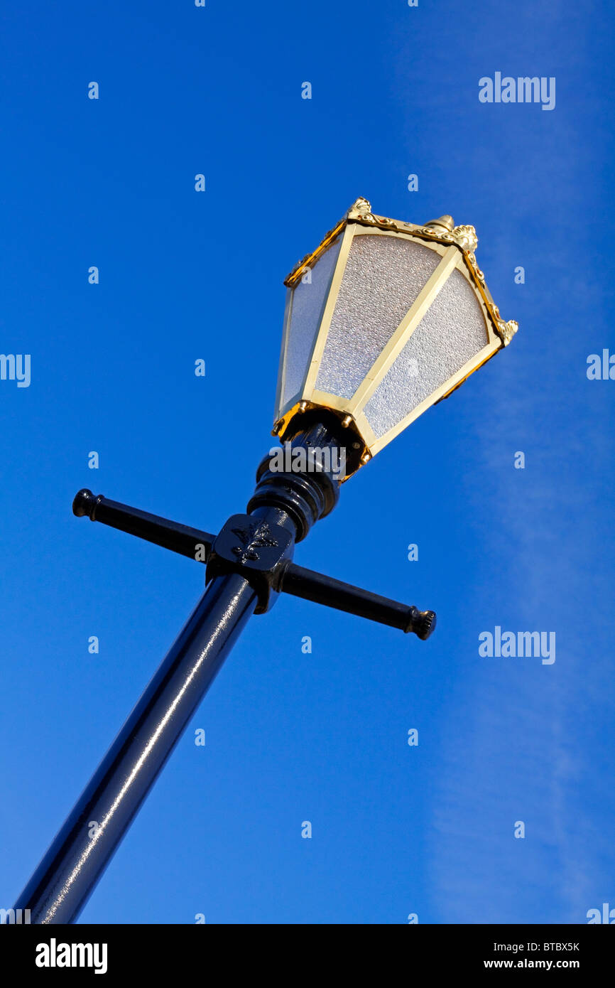 Decorative Victorian style street lamp with blue sky behind in Belper Derbyshire England UK Stock Photo