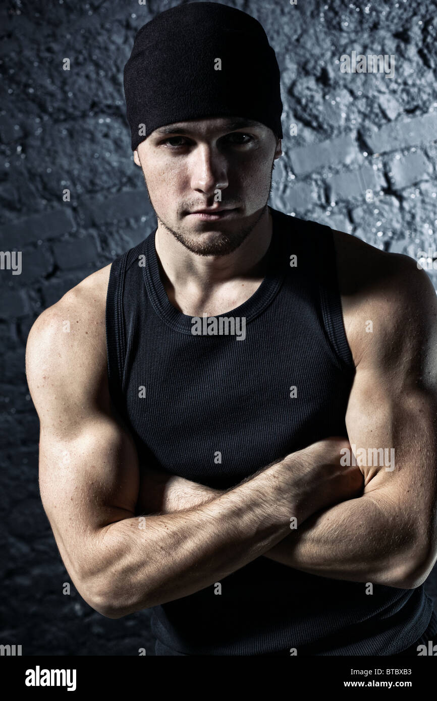 Young strong man portrait. Contrast colors. Stock Photo