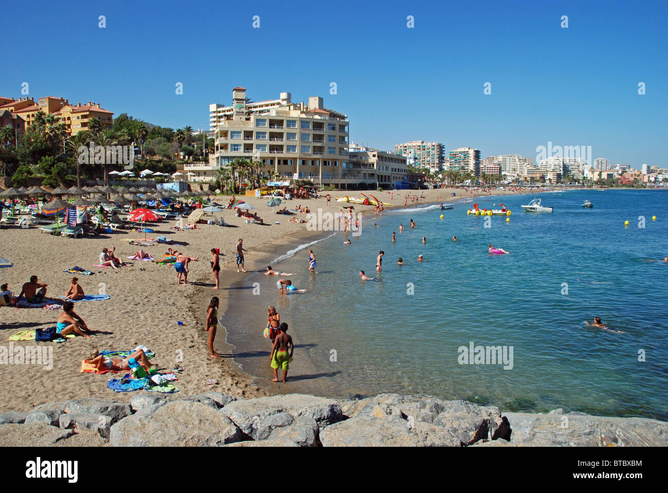 Holidaymakers on the beach, Benalmadena, Costa del Sol, Malaga Province