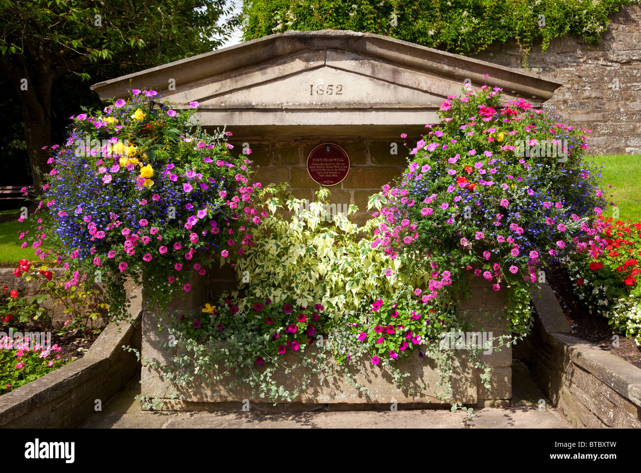 Floral display at Fox's head well, Pateley Bridge, North Yorkshire. Stock Photo