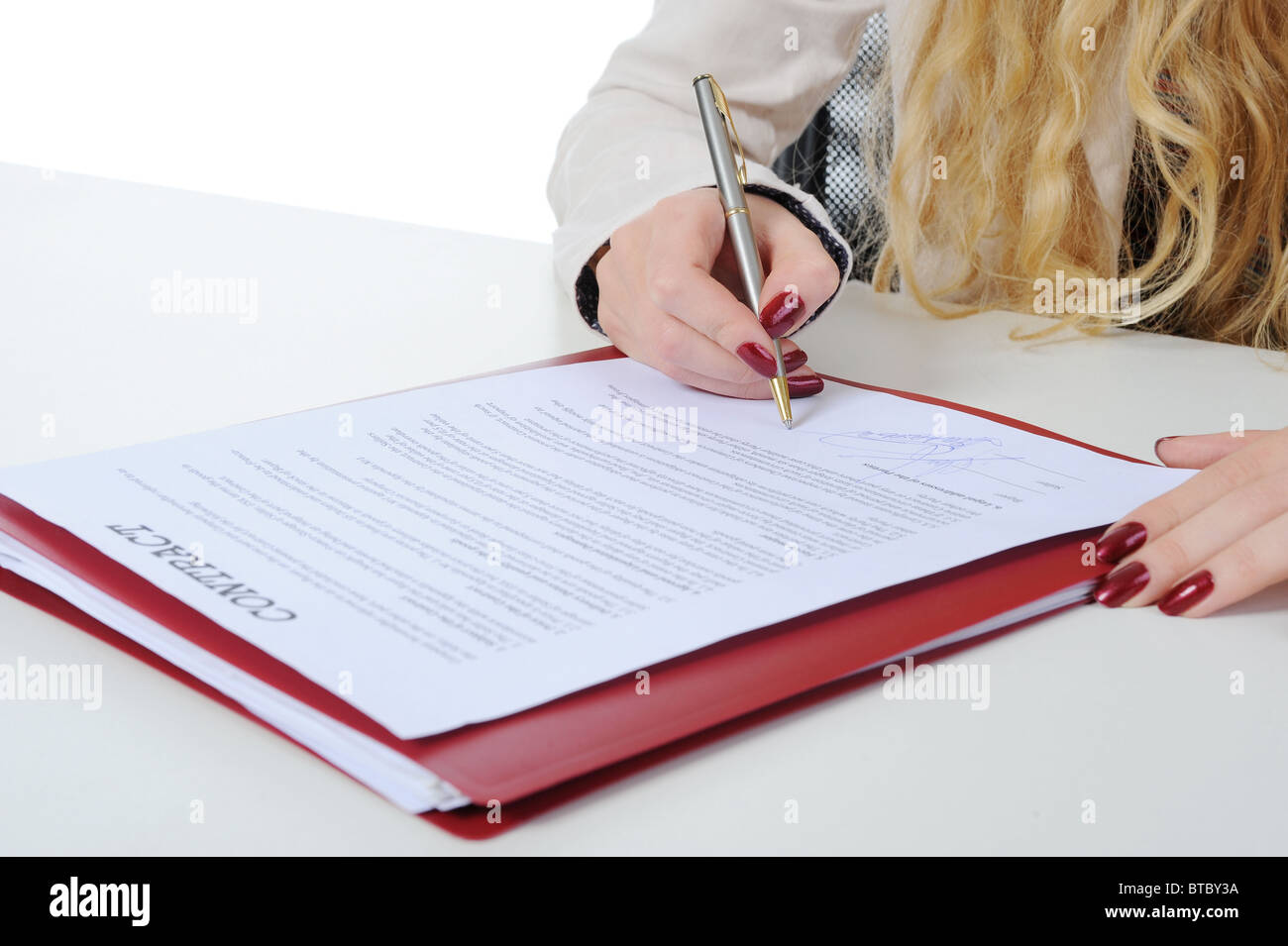 Businesswoman signs a contract Stock Photo
