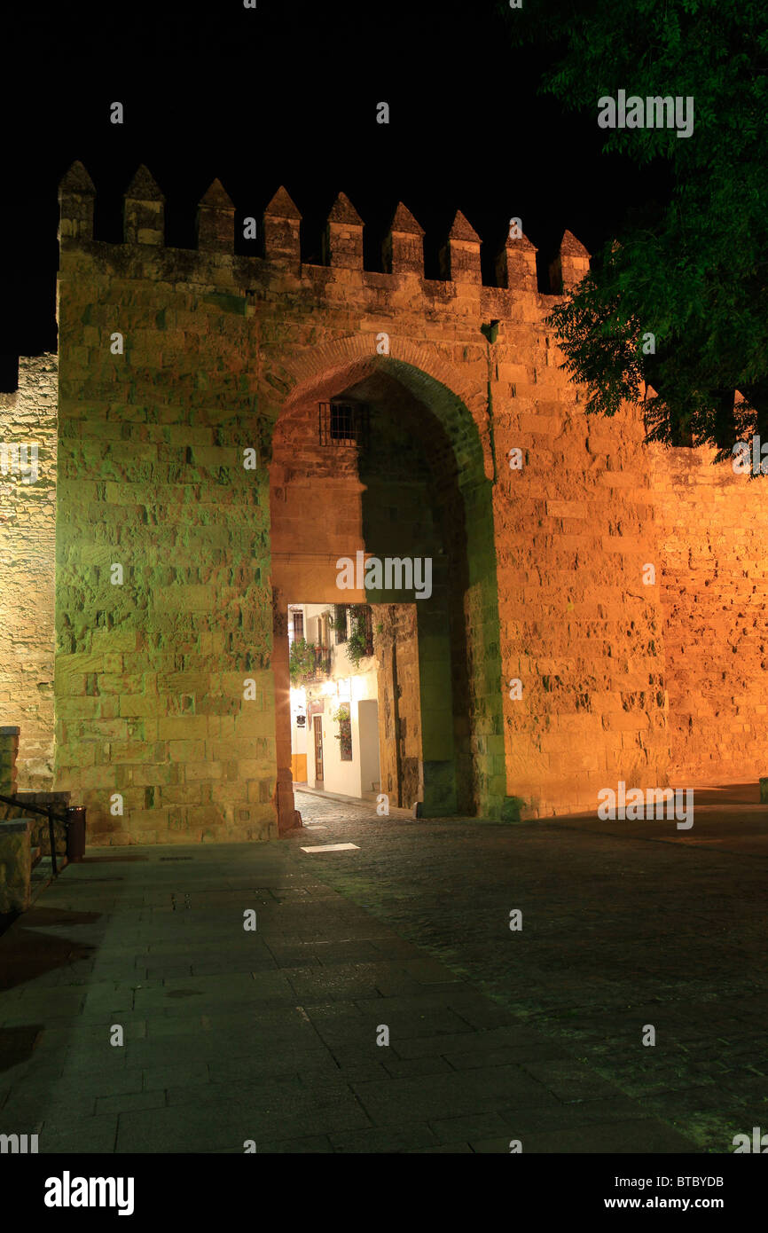 The medieval Almodovar Gate and city walls in Cordoba, Spain at night Stock Photo