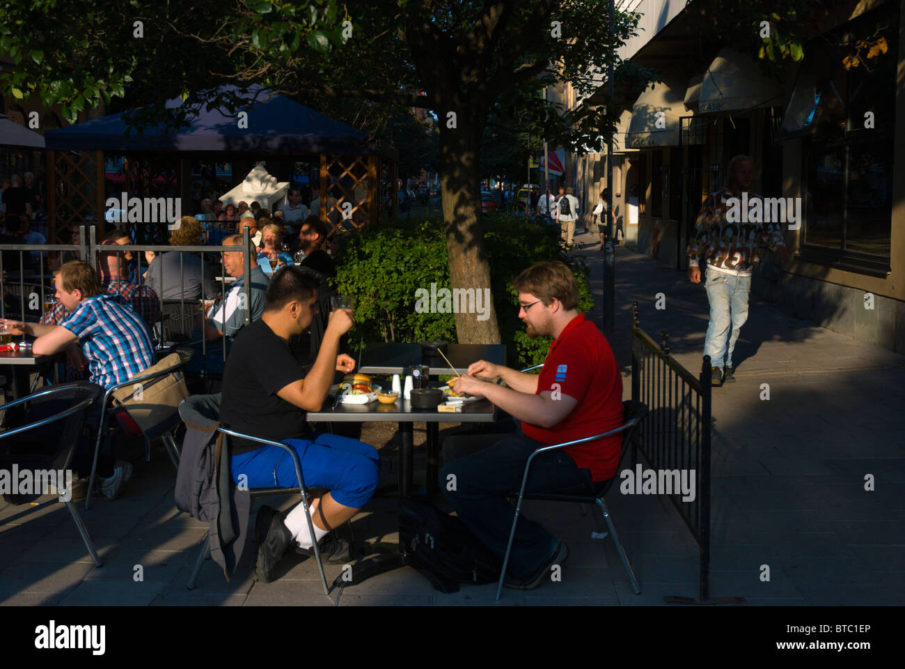People eating fastfood Södermalm district Stockholm Sweden Europe Stock Photo
