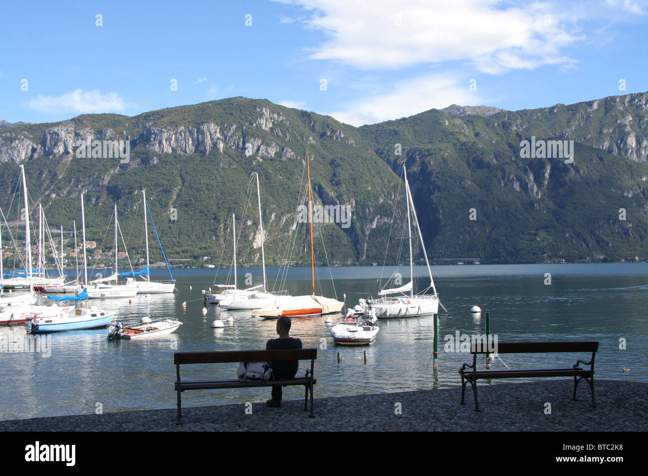 man contemplating Lake Como and the Grigne mountains at Pescallo Stock Photo