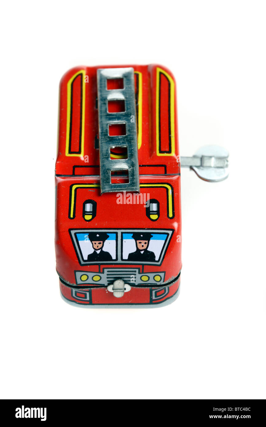 Tin toy, fire engine, wind up motor by a metal key. Stock Photo