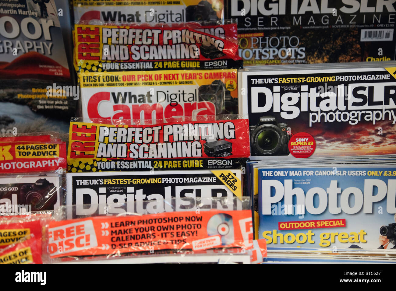A variety of different photography magazines for sale on a supermarket shelf. England UK Britain Stock Photo