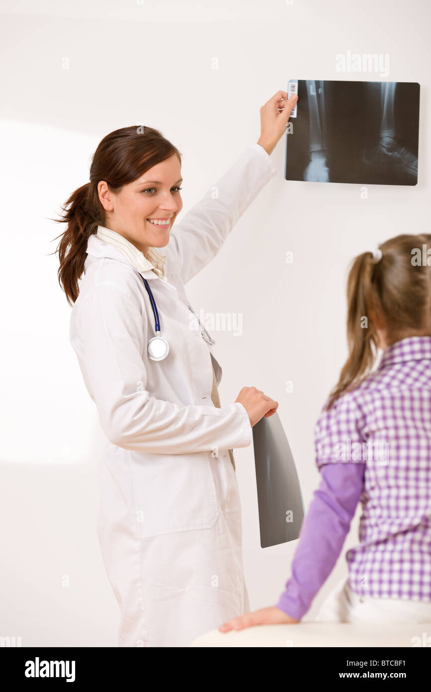 Young female doctor show xray to child at medical office Stock Photo Alamy