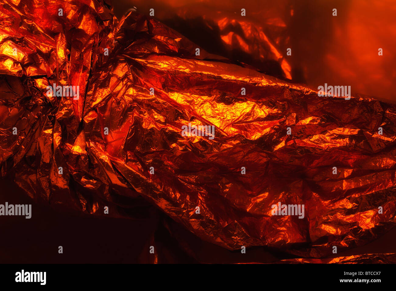 texture orange crumpled foil in closeup Stock Photo - Alamy