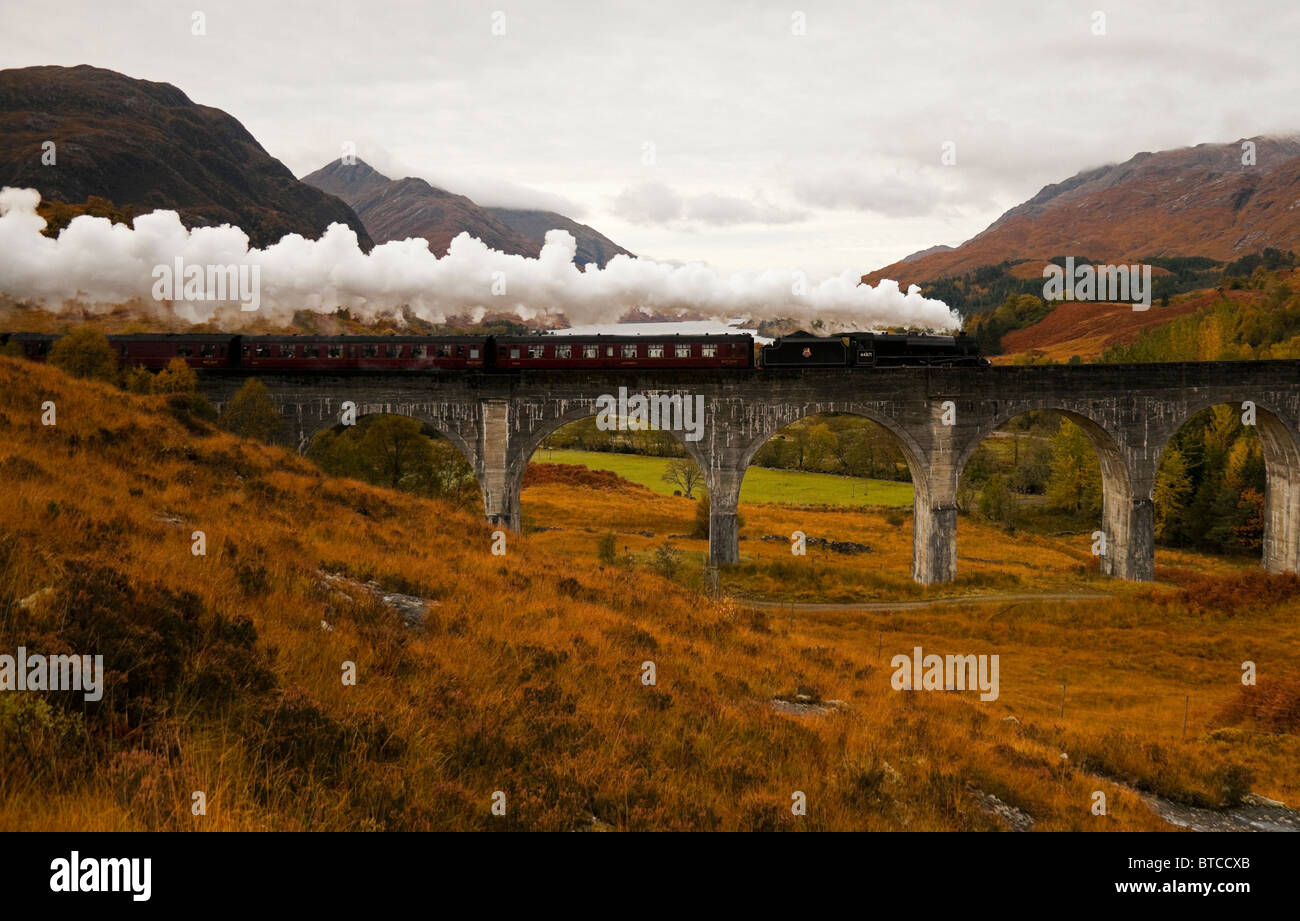 Jacobite Steam Train crossing the Glenfinnan Viaduct in Autumn, West Highland Line, Lochaber, Scotland, UK, Europe Stock Photo