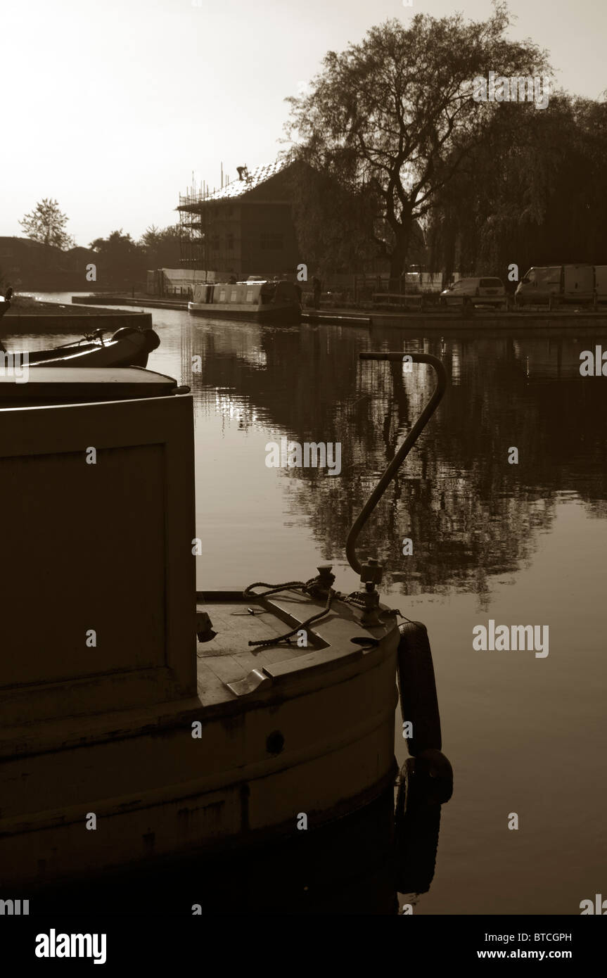 Canal narrowboats moored at Droylsden Marina, Tameside, Manchester, England, UK.  Sepia toned version of BTCXDA Stock Photo