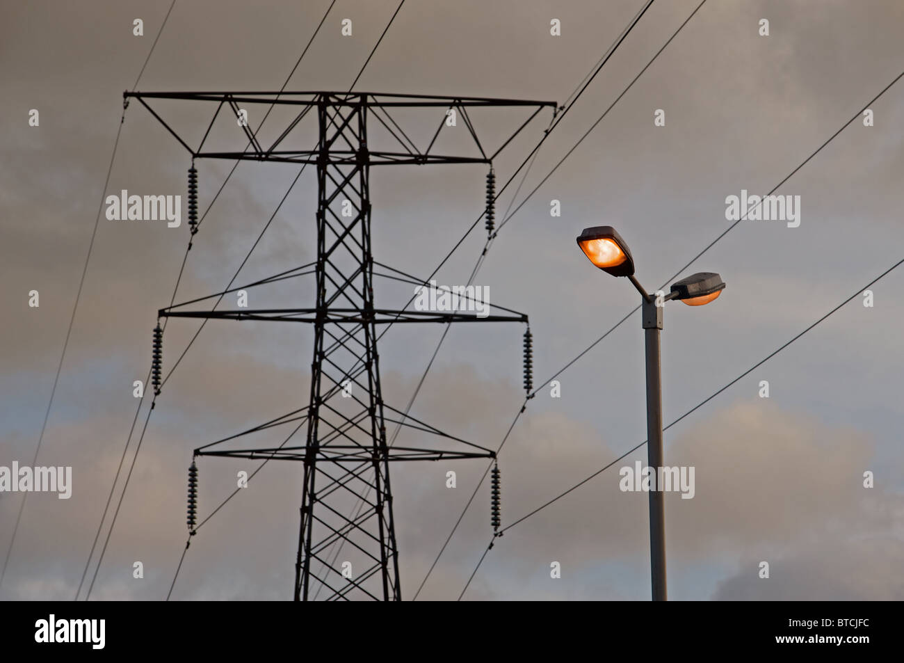Street light and highvoltage electricity pylon Stock Photo Alamy